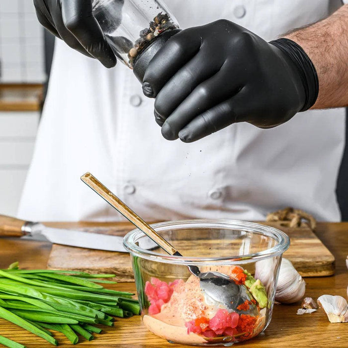Chef Wearing GP Craft 5.5 MIL Black Nitrile Exam Gloves While Handling Food